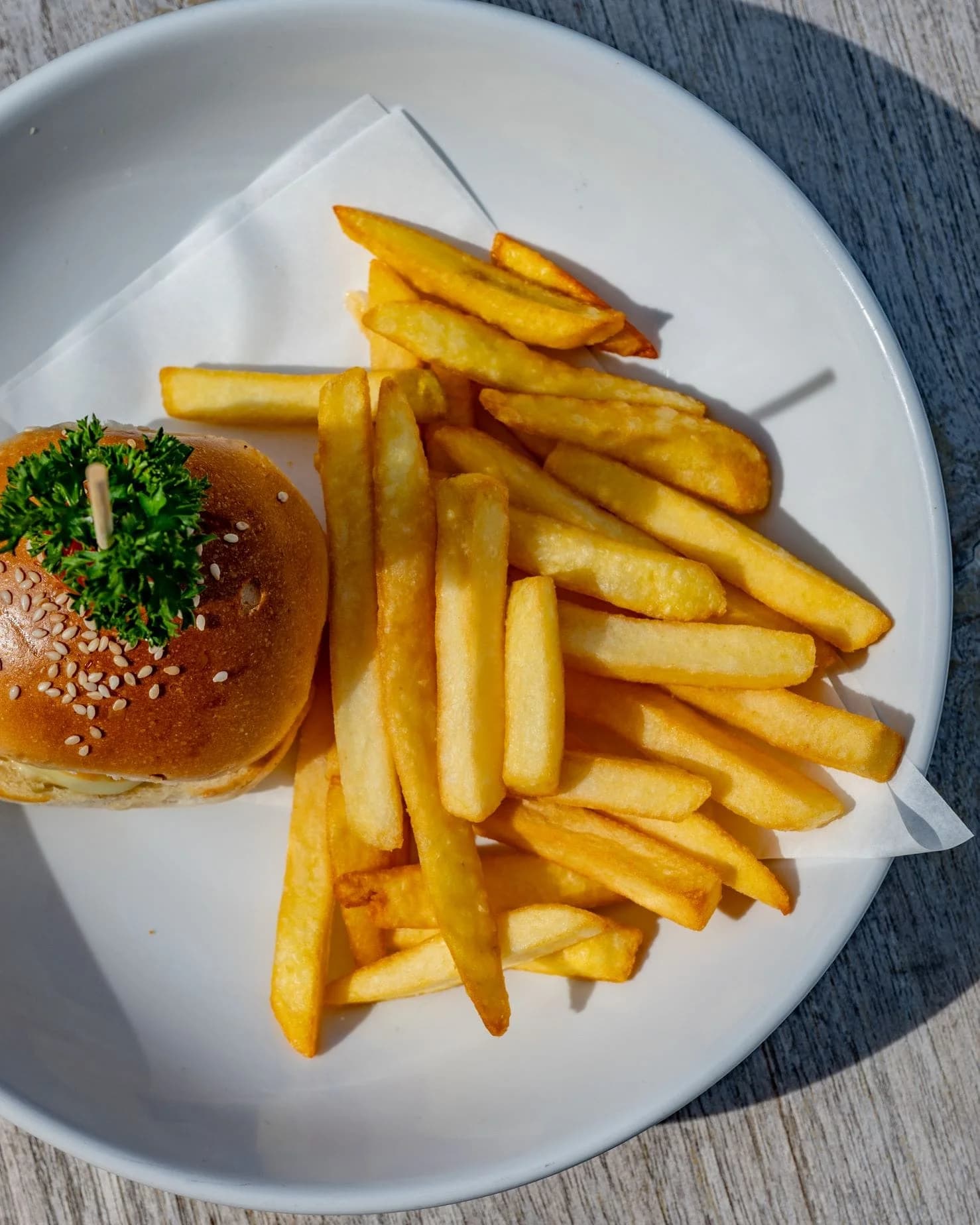 Wagyu smash-style cheeseburger and fries at SOHO Pool Club
