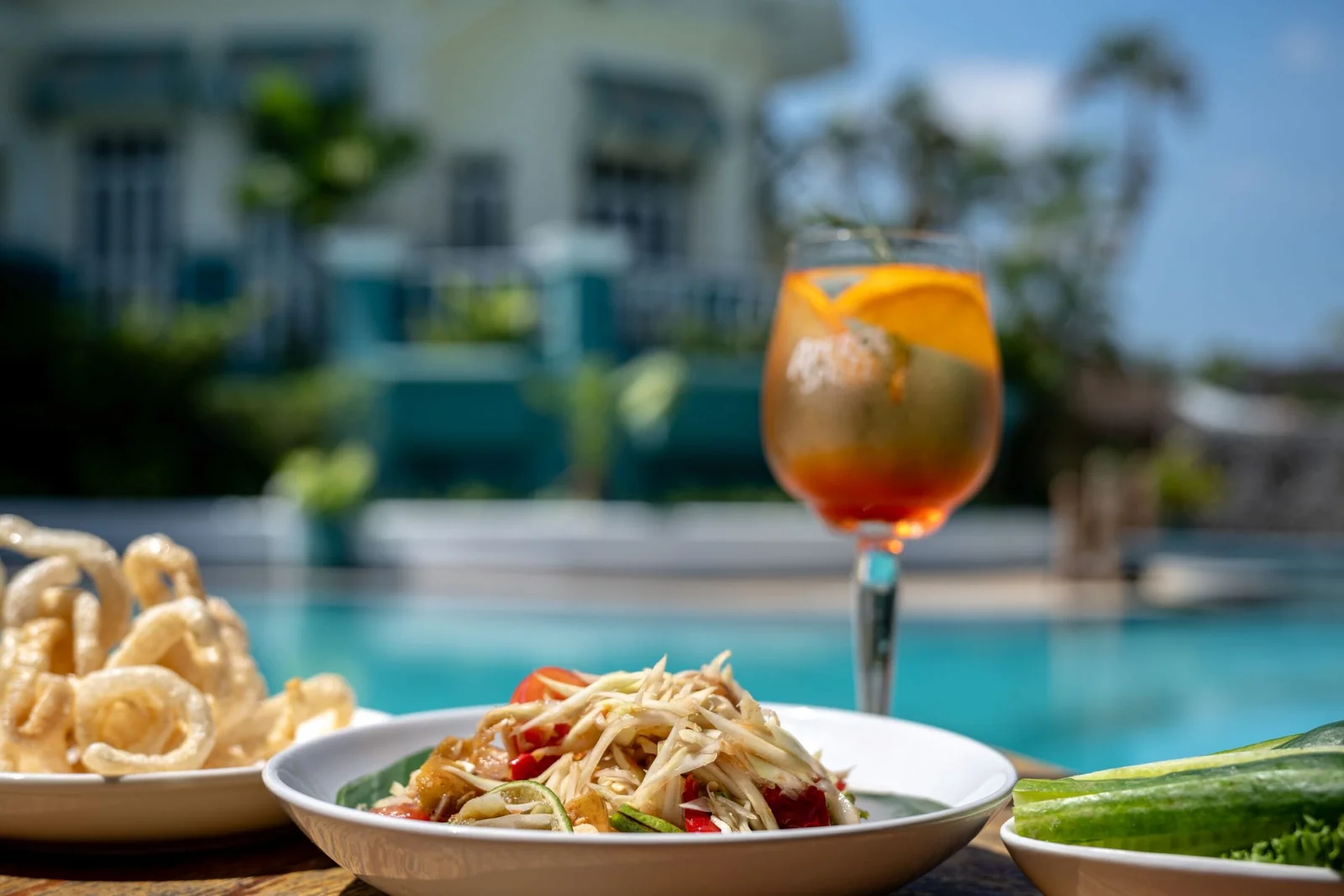 Som tum and an Aperol Spritz served poolside at SOHO Pool Club, Boat Lagoon Marina Phuket